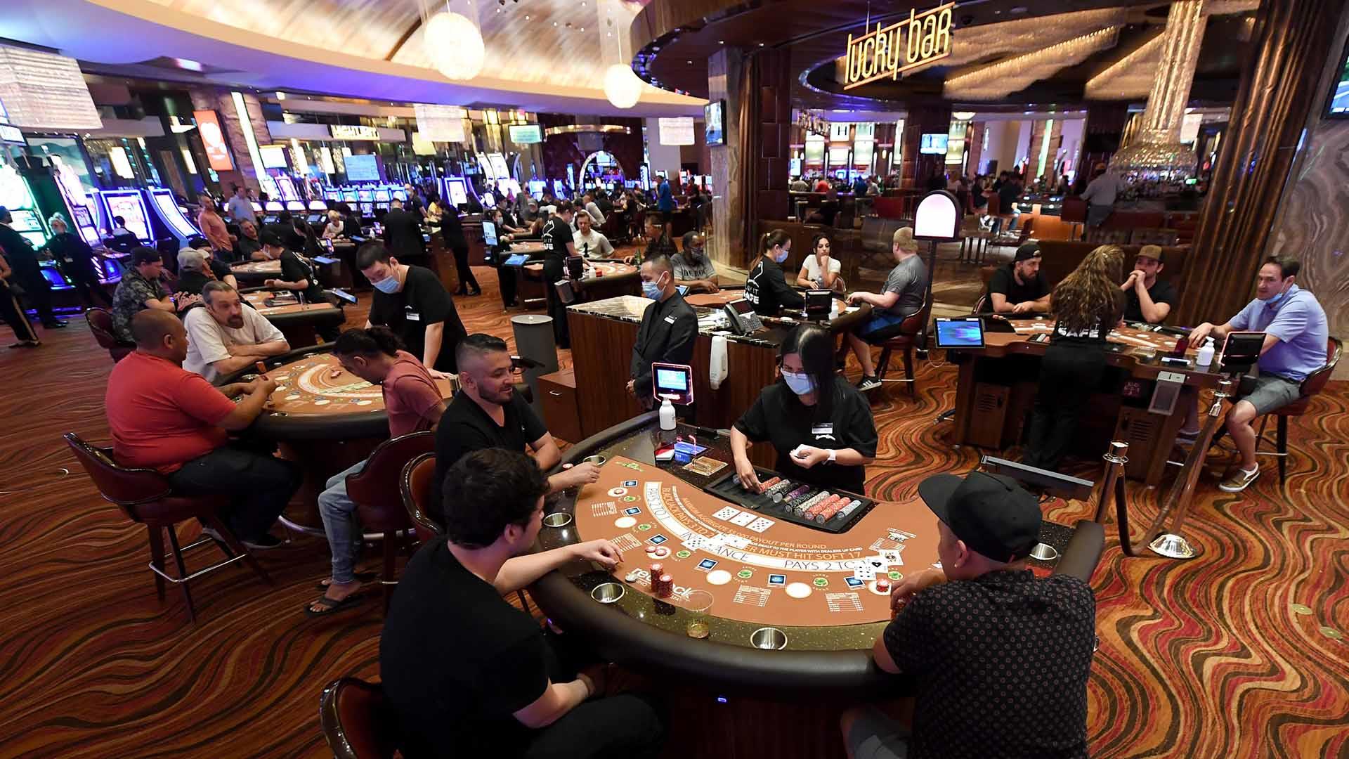 Revelers return to Las Vegas casinos after coronavirus closure ends